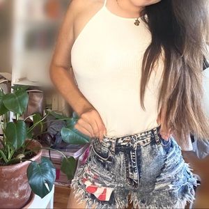 Studded distressed high waisted denim shorts with detailed pockets